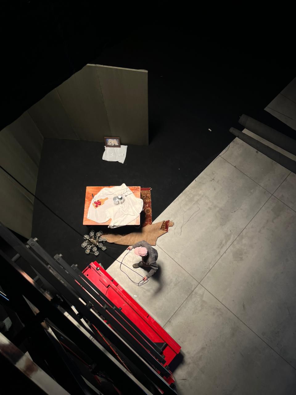 Overhead shot of a production set with props and crew at work