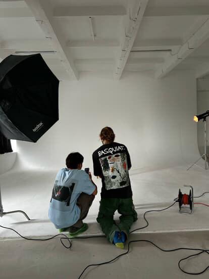 Director reviewing storyboards on a tablet during a shoot